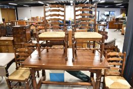 A set of six (four plus two) traditional ladder back dining chairs having rush seats