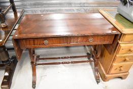 A reproduction Regency style side table having double frieze drawer and drop flaps