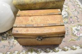 A vintage tin travel trunk