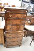A reproduction Regency bow fronted narrow chest of six drawers