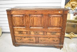 A 19th Century oak and mahogany coffer having flap top over drawer base (af)