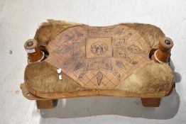 A vintage camel stool