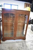 An early 20th Century stained frame display cabinet