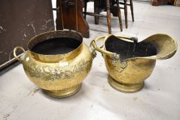 A traditional brass coal helmet and similar planter