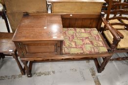 A traditional oak telephone seat
