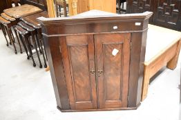 A 19th Century mahogany corner wall cupboard