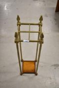 A vintage brass stick or umbrella stand
