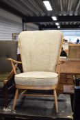 A light stained Ercol armchair