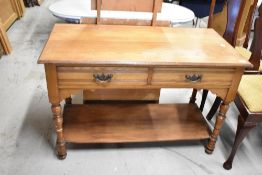 A Victorian mahogany side table/wash stand having double frieze drawer and under shelf, with