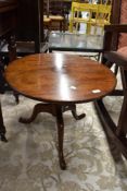 A 19th Century mahogany low pedestal table having circular top