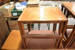 A nest of two G-Plan teak coffee tables, bearing lable to underside. Largest. 46CM.