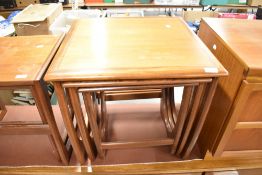 A vintage teak nest of tables, G plan or similar, being of shaped frame