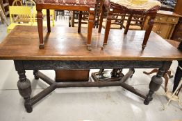 A period oak refectory style table having carved frieze drawers, possibly later or refurbished top