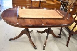 A reproduction Regency dining table