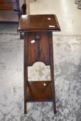 An early 20th Century oak jardiniere stand