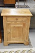 A 19th Century stripped pine cabinet