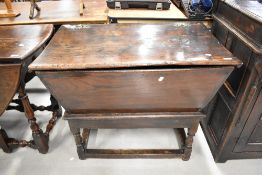 A period dough bin on turned legs, possibly Elm