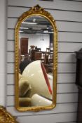 A reproduction gilt frame wall mirror