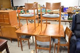 A vintage teak dining table and six chairs, White & Newton