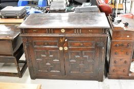 A period oak side cabinet with false frieze, lift lid and Jacobean style panelled doors