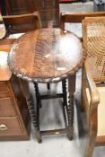 An early to mid 20th Century oak twist frame occasional table