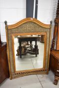 A modern woven wicker mirror having arched surmount. 125CM.