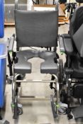 A disability toilet aid chair, as new