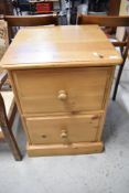 A modern pine two drawer filing cabinet