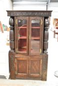 An interesting 19th Century stained frame display cabinet having lower cupboard section, possibly