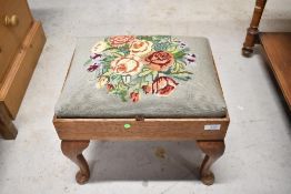An early 20th Century tapestry footstool with storage