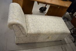 A modern day bed style ottoman