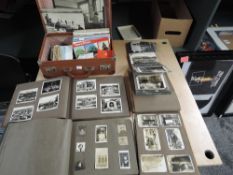 A collection of ephemera including four photograph albums, Cigarette and Trade Cards in albums and
