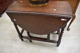 An early to mid 20th Century oak twist gateleg dining table