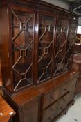 An early 20th Century Regency inspired mahogany breakfront bookcase