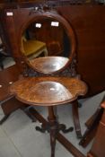 A very pretty Victorian walnut shaving or dressing stand having foliate decoration to mirror from,