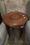 An early 20th Century Continental style octagonal occasional table having extensive mythical and