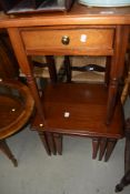 A reproduction low side table and similar nest