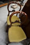 A pair of Victorian mahogany balloon back dining chairs
