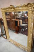 A 19th Century gilt plaster frame, with script to cartouche, having previously held portrait and now