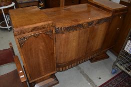 An Art Deco walnut sideboard, damage to foot