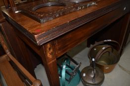 A 19th Century mahogany fold over tea table having shell and line inlay detailing