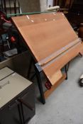 A vintage drawing board having engineered metal frame