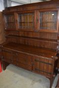 An early to mid 20th Century solid oak sideboard/dresser, possibly of German origins