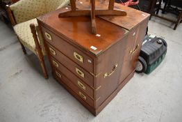 A pair of modern oriental campaign style chests with fold over tops