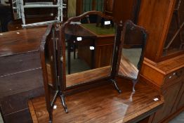A late 19th or early 20th Century mahogany triptych dressing table mirror