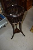 An early 20th Century mahogany torchere