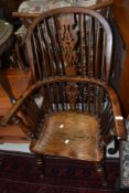 A 19th Century dark stained Windsor chair having shaped back and H stretcher