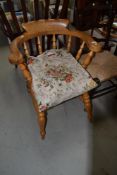 A traditional beech captains style elbow chair