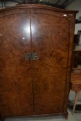 An early to mid 20th Century walnut wardobe in the French style
