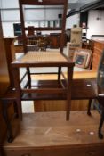 An Edwardian mahogany bedroom chair with cane seat and a small coffee table on cabriole legs